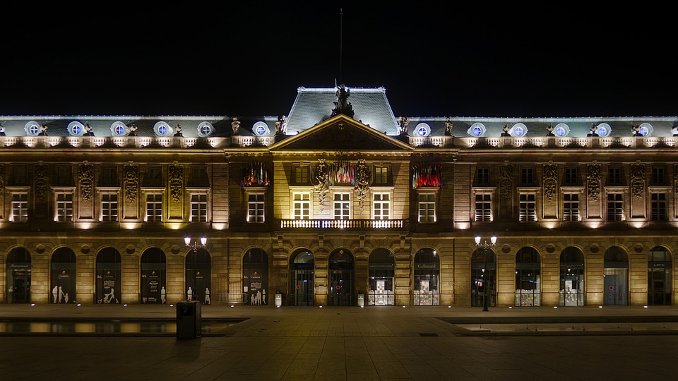 Illuminated facade of the Aubette